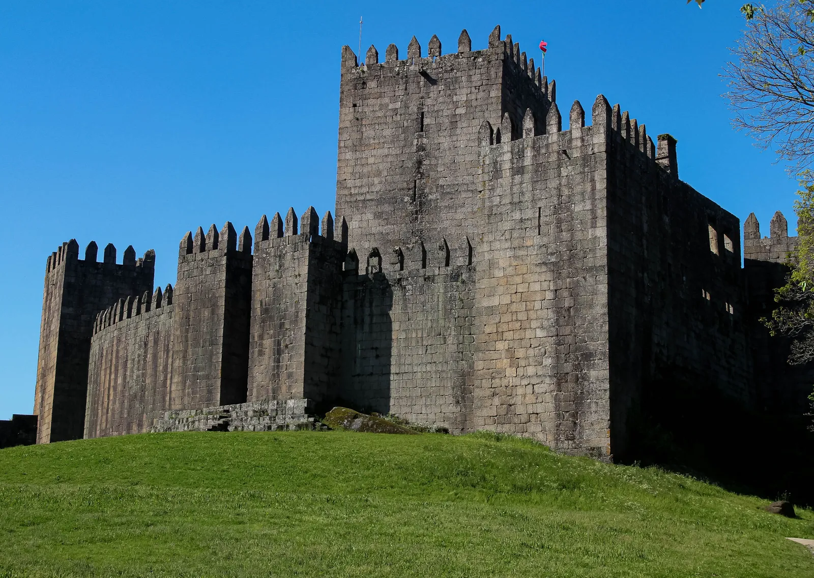 The medieval castle of Guimaraes on a hill above the old town, Portugal
