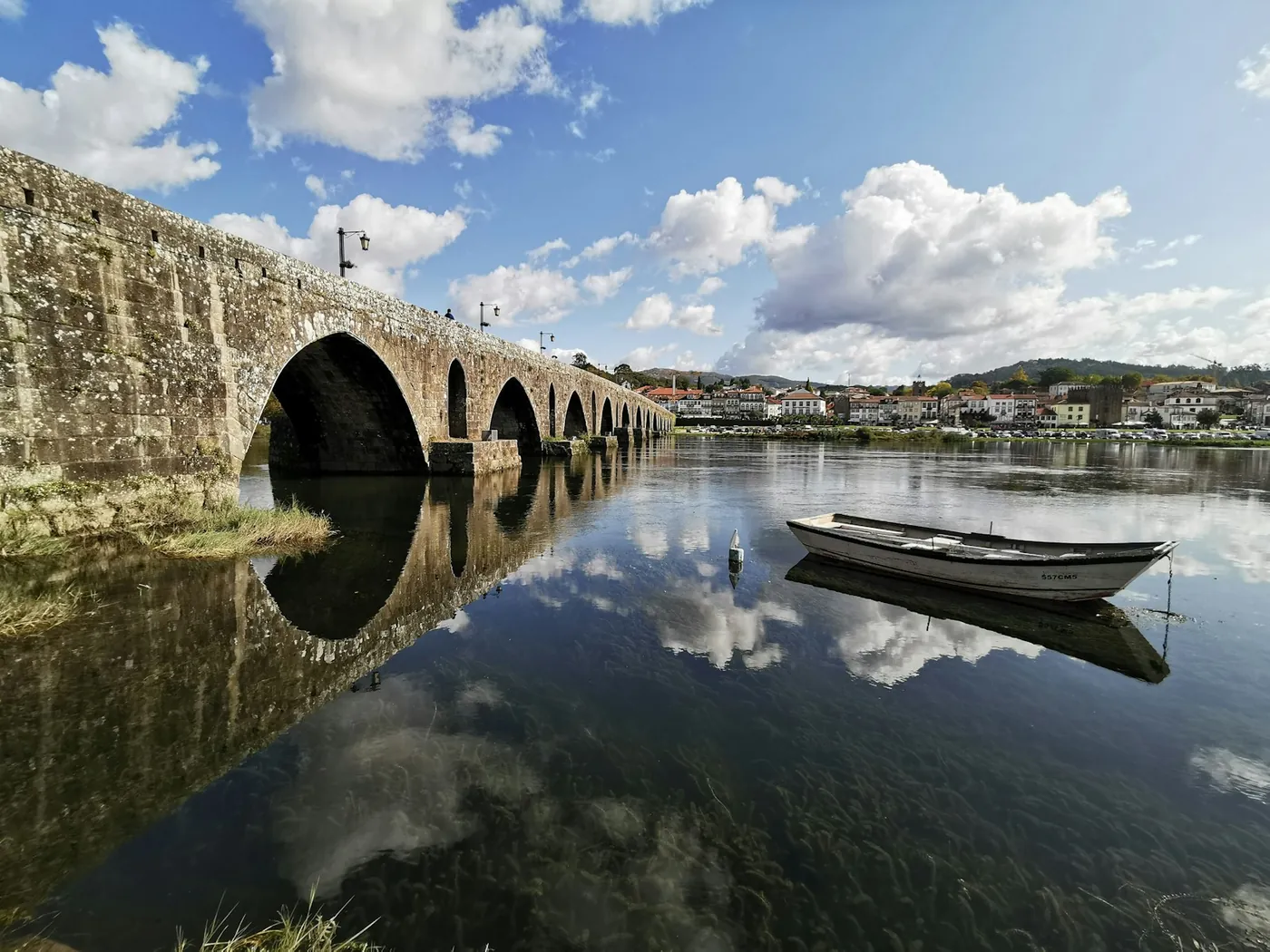 The medieval stone bridge over the river at Ponte de Lima in northern Portugal in daylight
