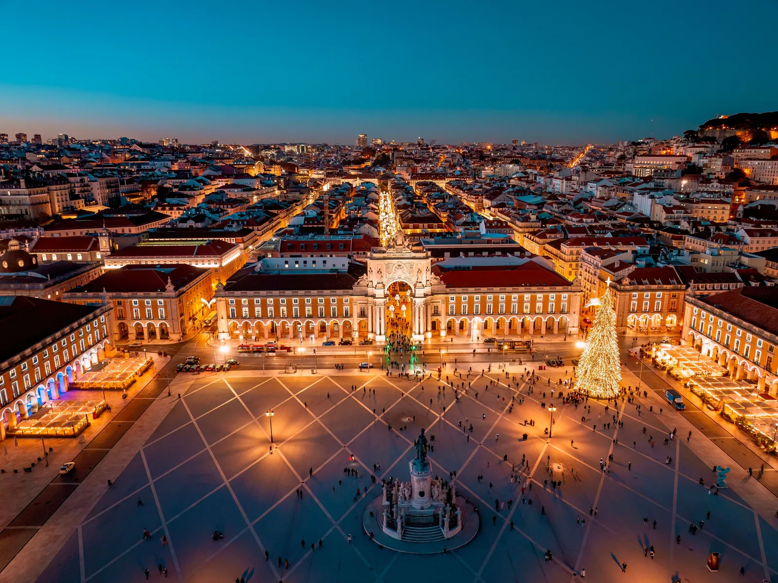Christmas lights and a decorated square in central Lisbon, Portugal, at dusk