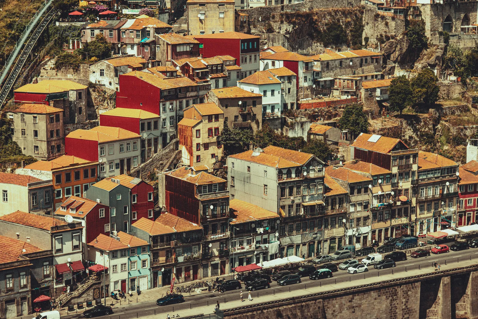 Colourful traditional houses along a hillside street in Porto, Portugal