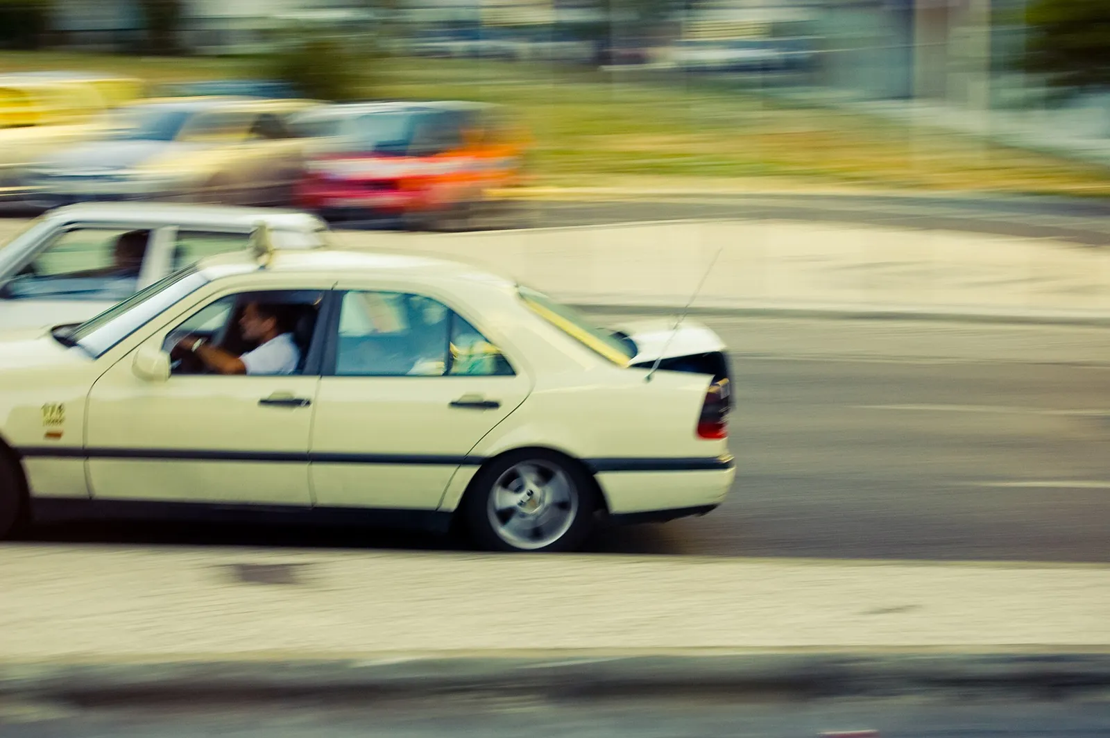 Traditional Portuguese taxi waiting on a city street