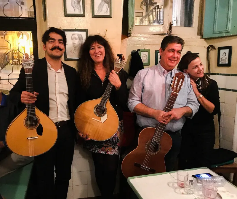 A fado evening at A Baiuca in Alfama, a singer and two string players