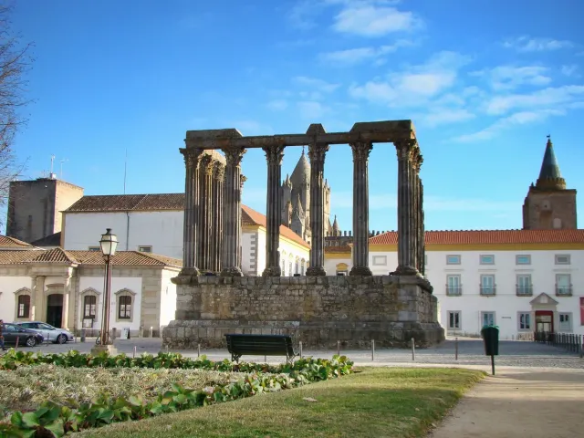 Roman granite columns with marble capitals on a stone platform in a square