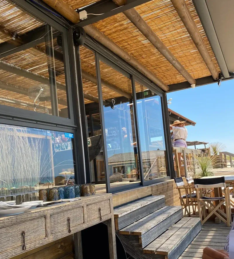 The timber and glass structure of the Sublime Comporta beach club