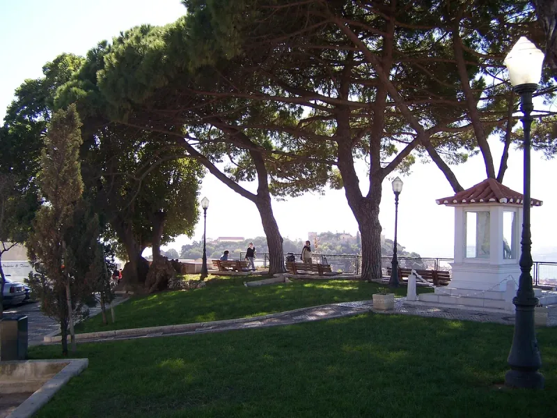 The Senhora do Monte viewpoint in Lisbon, with the city roofs and the river behind