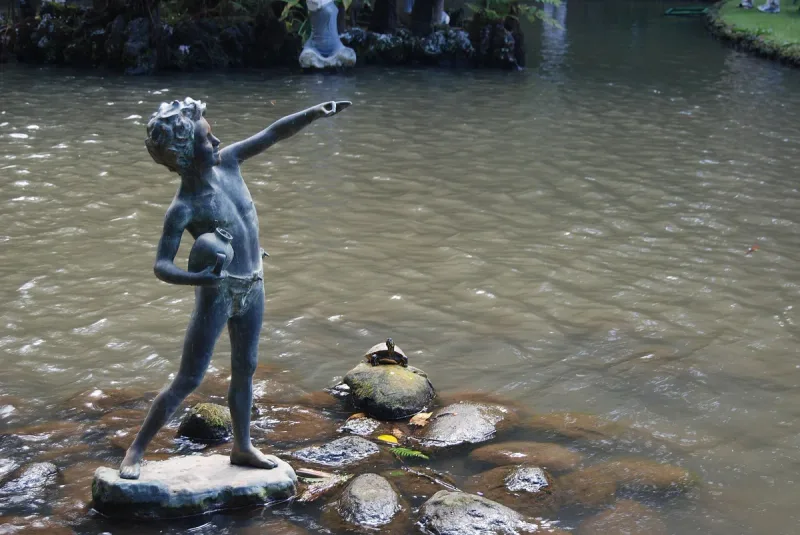 A statue and water basin in the tropical gardens of Monte Palace in Funchal