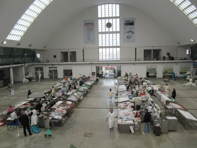 A long market hall with rows of fish counters and light from high windows