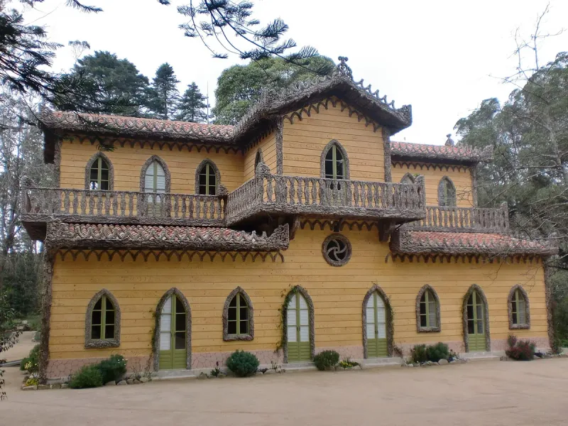 The yellow chalet of the Countess of Edla in the Pena park, with its carved balconies
