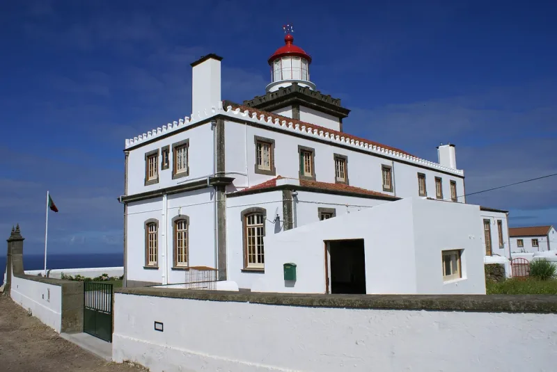 The lighthouse at Ponta da Ferraria on Sao Miguel, on the cliff above the sea