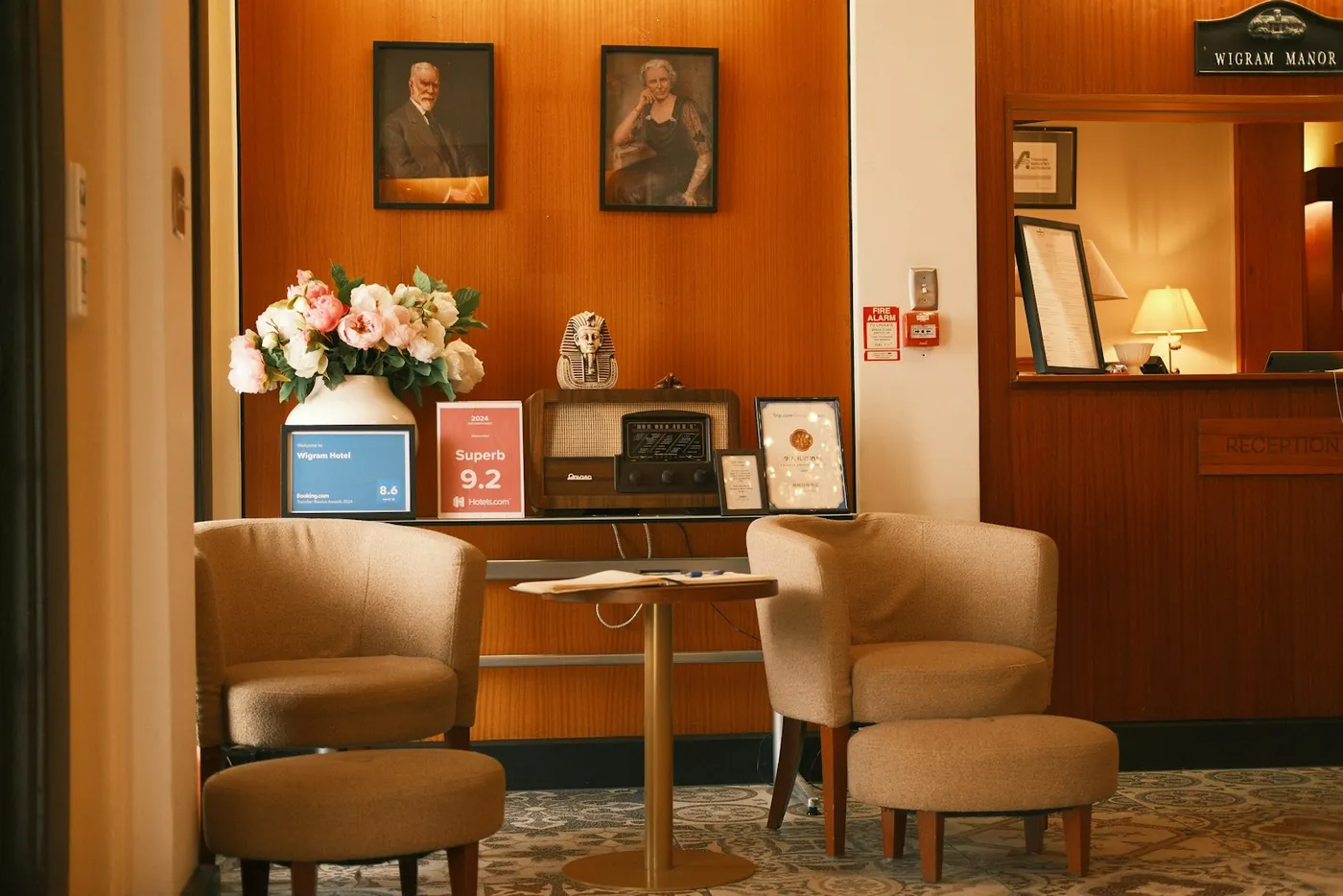 Armchairs and a low table in the lobby of a small hotel