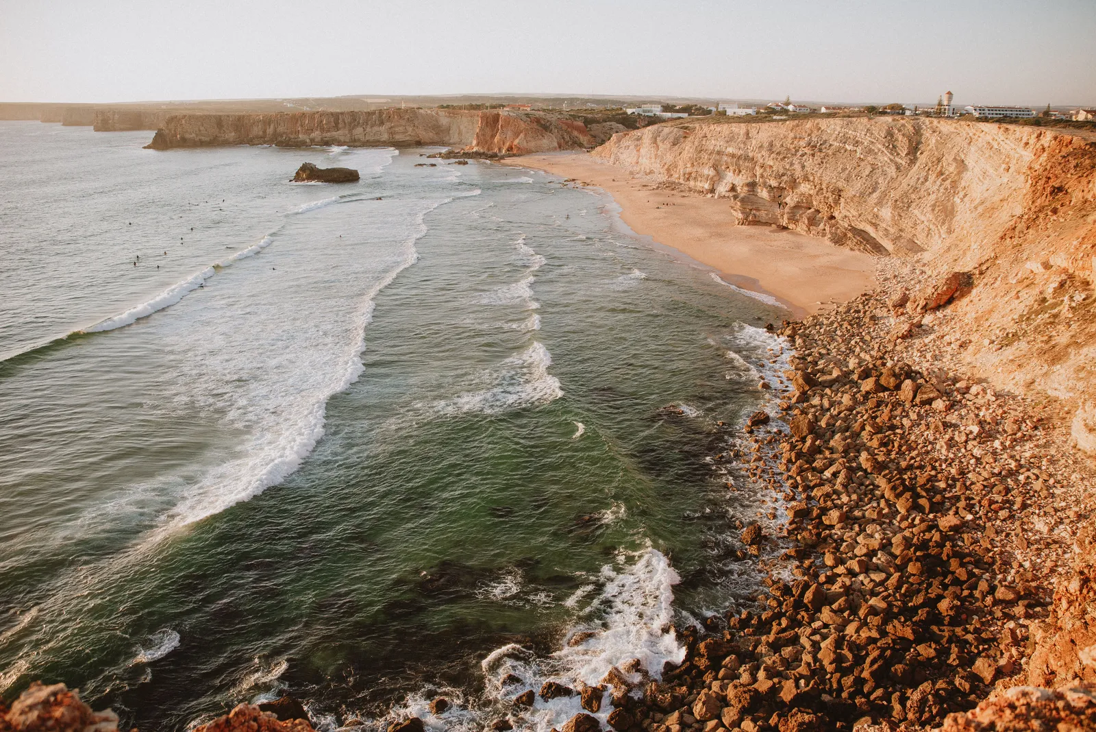 A beach along the Algarve coastline in the late afternoon light