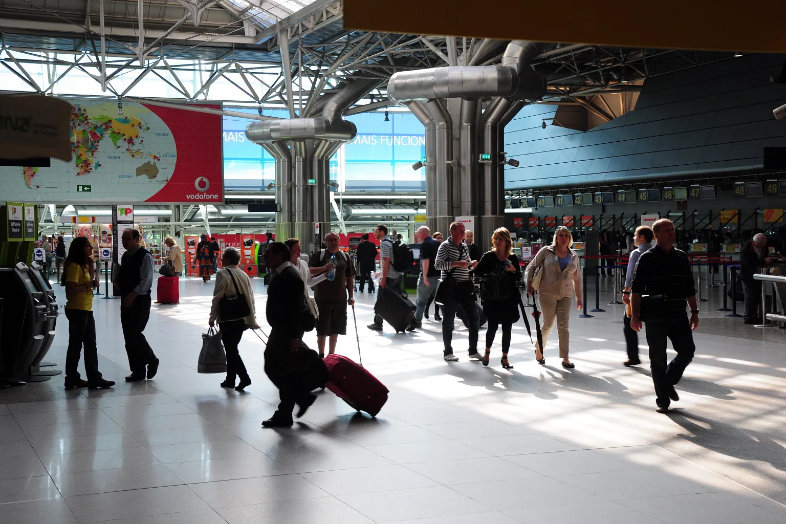 Departures board and check-in area inside Lisbon Airport, Portugal